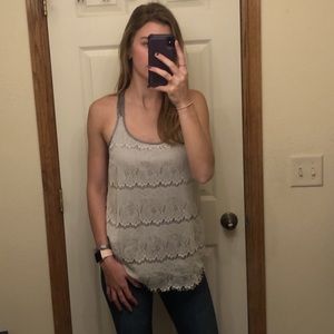 Cute lacy sleeveless top with bow in back